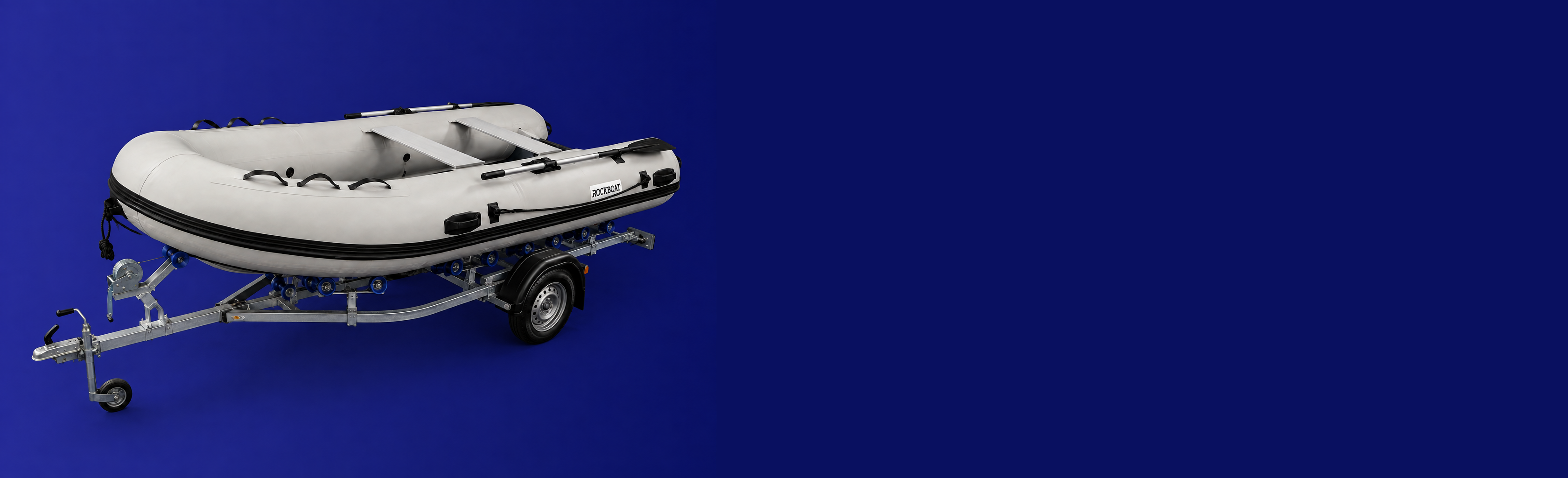 Light-grey Rockboat aluminium RIB on a trailer